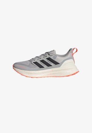 Gray athletic shoes with black stripes, textured upper, cushioned sole, and orange accents on the heel and sole. Lightweight design.