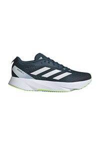 Sports shoes with a dark blue mesh upper, white synthetic stripes, and a textured white midsole featuring a neon green accent on the outsole.