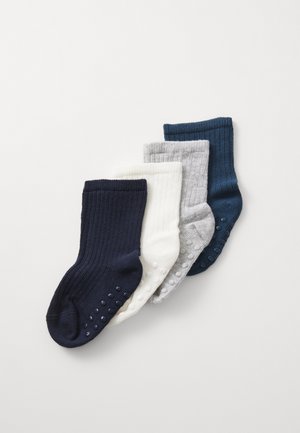 Vier paar geribde sokken in marineblauw, wit, lichtgrijs en donkergroen, met antislip siliconen stippen op de onderkant voor grip.