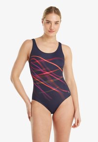 Blauwe badpak met meerkleurige abstracte lijnen. Heeft een hoge hals, brede bandjes en een aansluitend ontwerp. Glad, rekbaar materiaal.