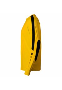 Maglietta a manica lunga gialla con strisce laterali nere, toppe sui gomiti e accenti circolari dorati sulle maniche. Realizzata in tessuto leggero.