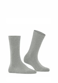 Chaussettes en coton gris avec un bord côtelé et une texture lisse, de longueur mi-mollet et au design simple et uni sans motifs ni accents.