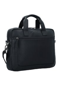 Mustassa nahkakannettavassa on kaksinkertainen kahva, irrotettava olkahihna, etupuolella vetskari-tasku ja sileä pinta. Suorakulmainen muoto, jossa pyöristetyt kulmat.