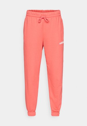 Koral joggebukser med elastisk midjebånd og justerbar snøring. Mansjetter ved anklene og hvit Adidas-logo trykket på hoften.