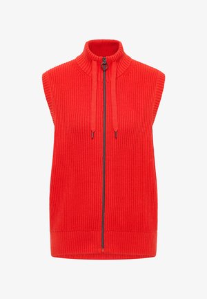 Červená vesta bez rukávů s vysokým límcem, žebrovanou texturou, předním zipem a šňůrkami jako ozdobou. Vyrobena z měkkého pleteného materiálu.