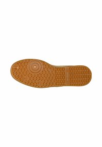 Semelle de chaussure brun clair avec motifs géométriques, détails circulaires près de l’orteil, et le nom de la marque "wojas" embossé au centre.