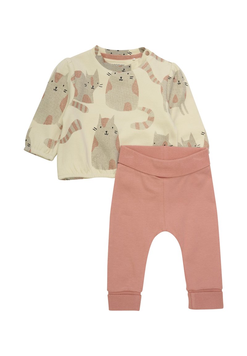 Twee-delige kinderoutfit bestaande uit een crèmekleurig langemouwen T-shirt met een kattenpatroon en roze katoenen leggings met enkelmanchetten.