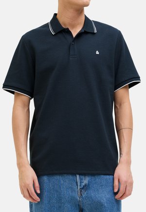 Marine polo shirt van een gestructureerde stof, met witte strepen op de kraag en mouwen, en een klein logo op de borst.