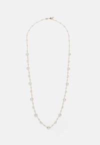 Gold necklace with round clear crystals spaced along a delicate chain. Each crystal is set in a circular bezel, creating a reflecting effect.