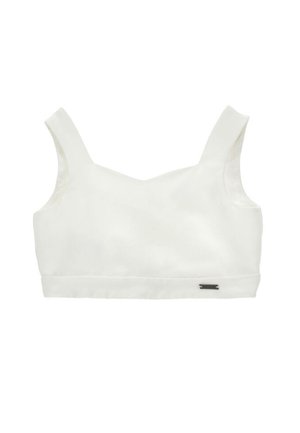 Top corto bianco con spalline larghe e una piccola targhetta in metallo sull'orlo inferiore destro.