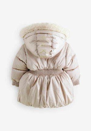 Puffer coat in light beige with a faux fur hood, smocked waist, and gathered skirt detail. Features "BAKE" text on the back in gold.
