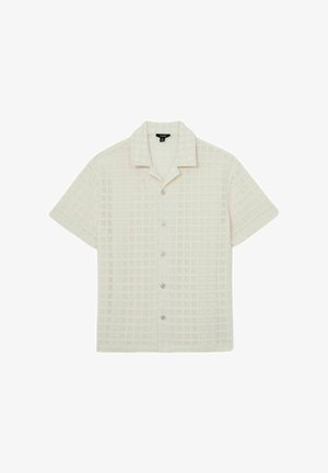 Krátky rukáv béžový pletený sveter s textúrovaným mriežkovým vzorom, zapínaním na gombíky vpredu a otvoreným golierom.