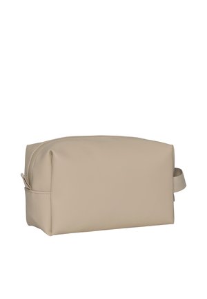 Beige rektangulær toalettmappe med glidelåslukking og stoffhåndtak på den ene siden, vist mot en hvit bakgrunn.