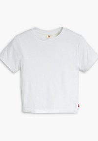Biała bawełniana koszulka z krótkim rękawem, okrągłym dekoltem i skróconym krojem. Posiada małą czerwoną metkę logo po lewej stronie u dołu.