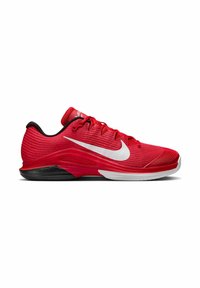 Scarpe sportive rosse con una tomaia testurizzata, logo Nike bianco, contrafforte nero e una suola bianca prominente. Progettate per prestazioni e supporto.
