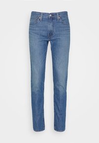Ljusa blå denimjeans med rak passform, fem fickor, bältesöglor och knappstängning. Tyget har en slät yta med minimal urtvättning.