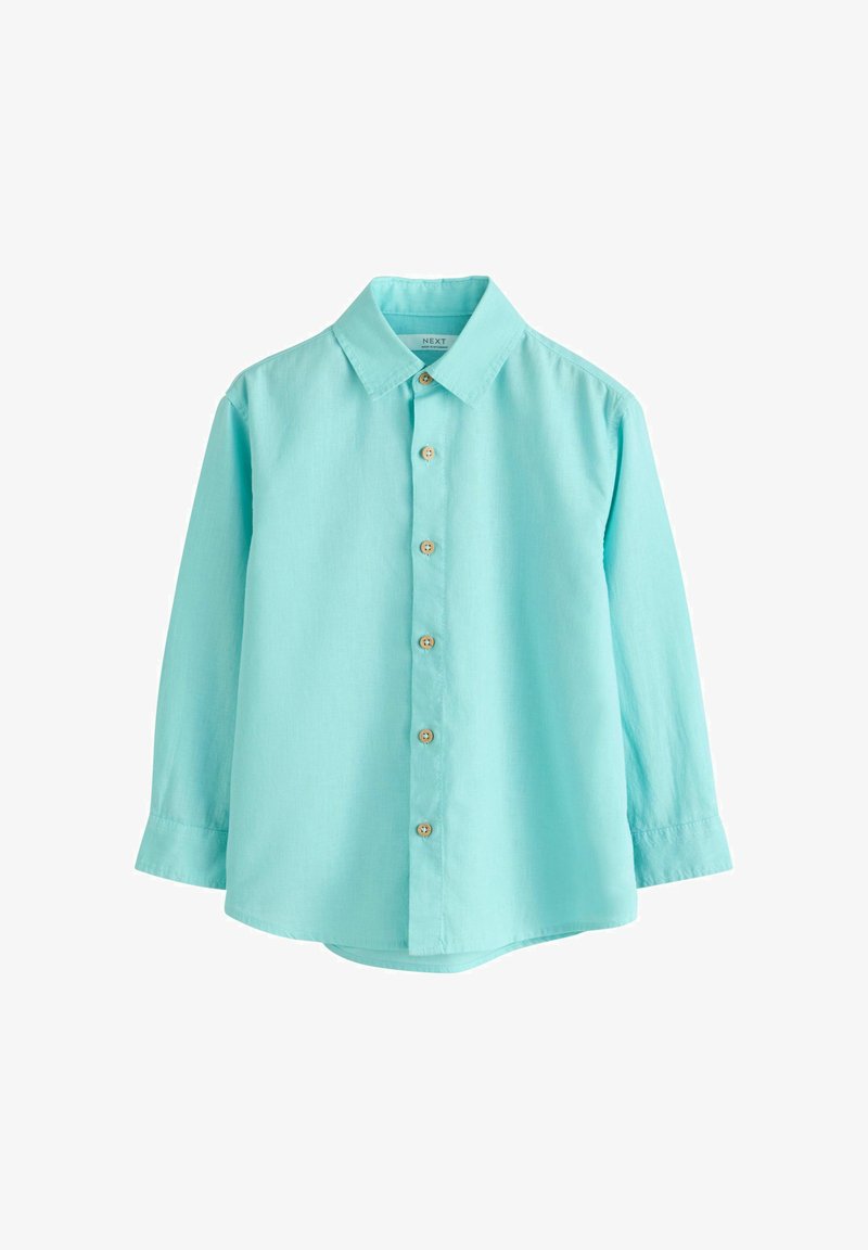 Chemise en coton bleu clair à manches longues avec boutons en bois, col classique et poignets boutonnés, présentée sur fond blanc.