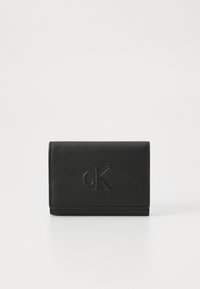 Black leather wallet with a smooth texture, featuring an embossed CK logo on the front, and a compact rectangular shape.