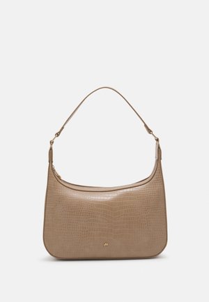 Beige Schultertasche aus Kunst-Krokodilleder mit schmalem Riemen und goldfarbenem Reißverschluss-Detail auf einfarbigem Hintergrund.