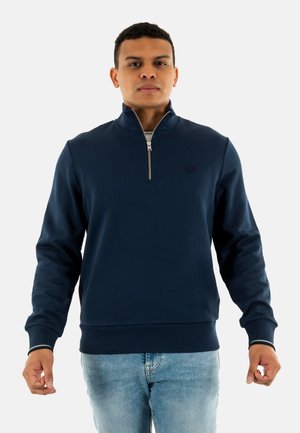 Felpa girocollo blu navy con colletto con zip, polsini e orlo a coste. Presenta un piccolo logo sul petto. Tessuto morbido.