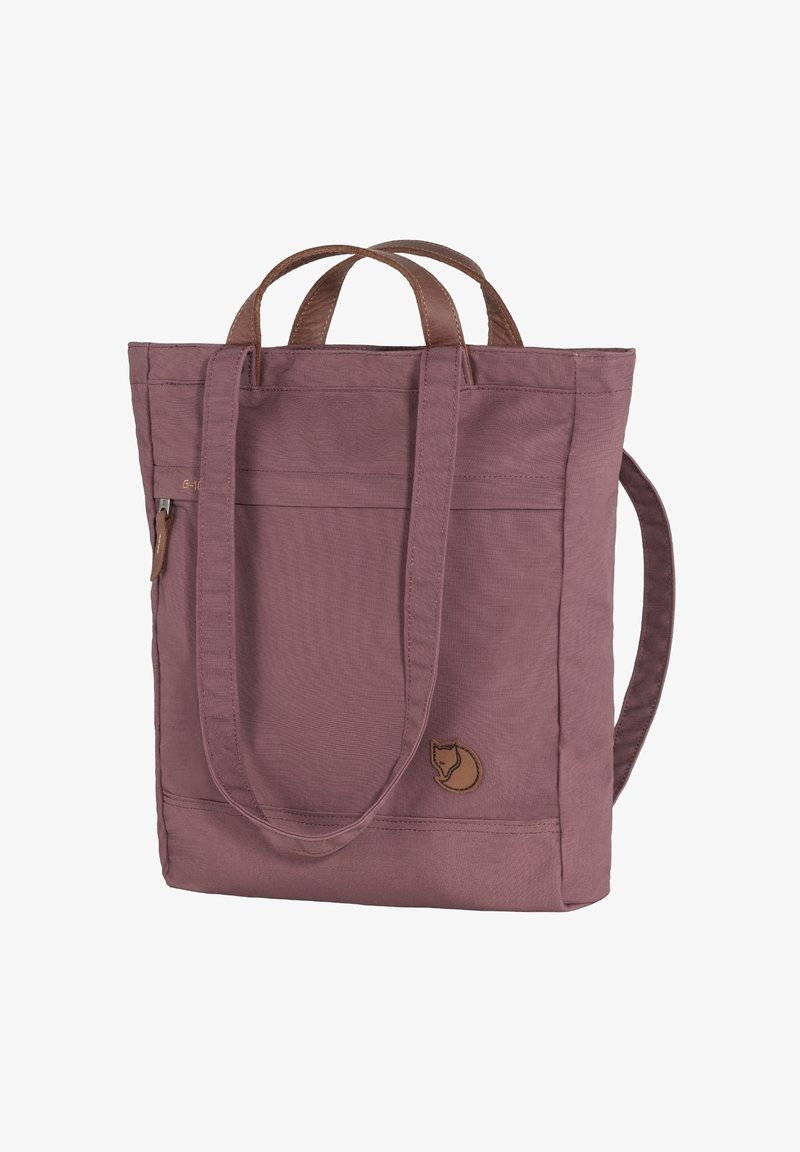 Purple fabric tote bag with two top handles, adjustable shoulder strap, front zip pocket, and a logo patch featuring a stylized animal.