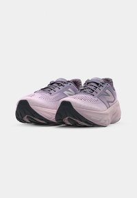 Light purple running shoes with mesh upper, reflective accents, and thick black outsole. Features cushioned midsole for comfort and support.