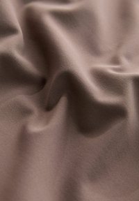 Brown, smooth fabric with subtle draping and texture, showcasing a consistent color and soft appearance.