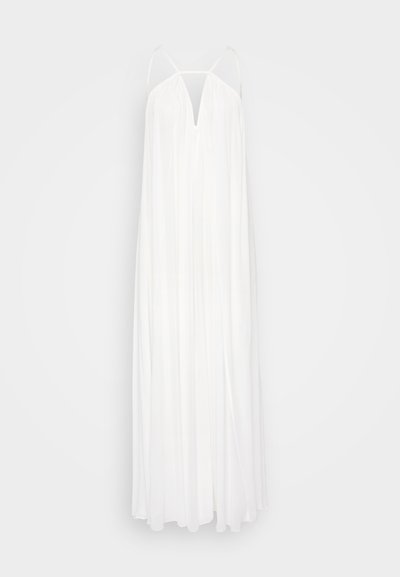 White maxi dress with thin straps, V-neckline, and flowing, lightweight fabric. Features a loose silhouette and pleated texture.