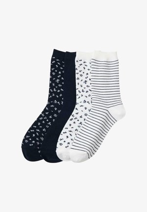 Fyra par strumpor i mörk marinblå, vita med små marinblommor och vita med marinränder; blandning av bomull med slät textur och standardlängd.