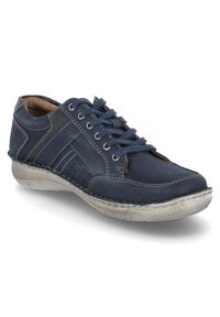Navy leather shoe featuring a rounded toe, lace-up design, perforated detailing, and a textured light gray rubber sole.