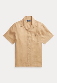 Camisa de lino beige de manga corta con diseño de botonadura, que incluye un bolsillo y un pequeño logotipo bordado en el pecho.