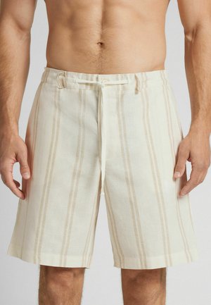 Leinen-Shorts in einem hellen Cremeton mit vertikalen beigen Streifen. Mit einem verstellbaren Kordelzugbund und seitlichen Taschen. Glatte Textur.