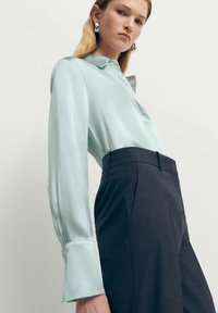 Mango Bluza s gumbima - light blue