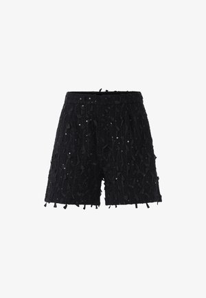 Pantaloni neri realizzati in tessuto testurizzato, con un design stratificato decorato con paillettes e dettagli in tessuto, completati da un orlo dritto.