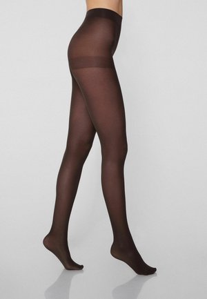 Durchsichtige braune Strumpfhosen mit glatter Textur und undurchsichtigem Bund, die ein körpernahes Design an einem seitlich sichtbaren Bein vor einem hellen Hintergrund präsentieren.