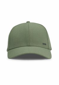 Green cap made of textured fabric, featuring a curved brim, six panels, and a small black logo on the front.