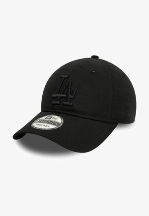 Black baseball cap made of fabric with a raised, black embroidered "LA" logo on the front. Features a curved brim and adjustable strap.