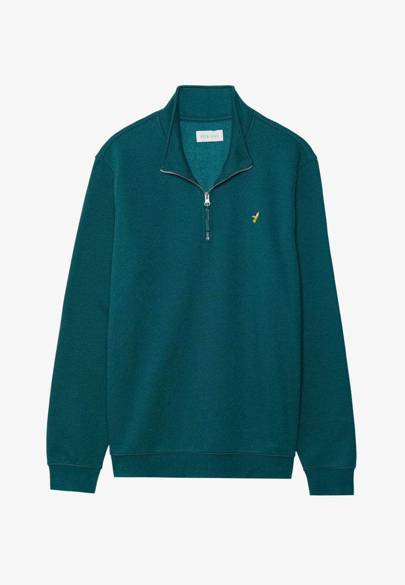 Sweat-shirt zippé teal avec un col montant. Présente un accent logo doré sur la poitrine et des poignets et un ourlet côtelés. Texture de tissu douce.