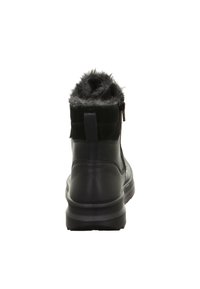 Stivaletto in pelle nera con un morbido colletto in pelliccia sintetica grigia, chiusura con zip sul retro e suola in gomma per una migliore aderenza. Dettagli di cucitura minimi.