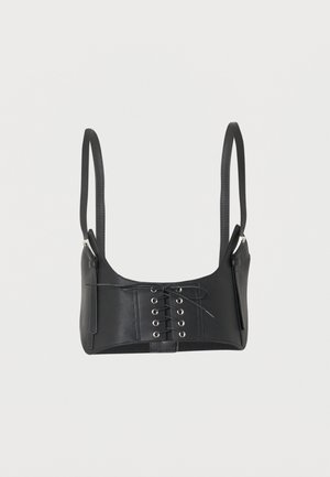 Zwarte cropped leren bustier met vetersluiting aan de voorkant en verstelbare dunne schouderbandjes.