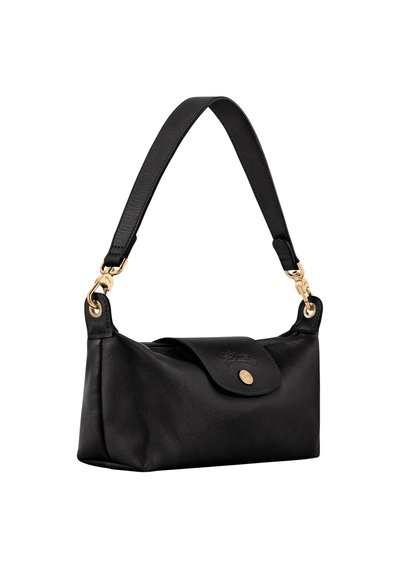 Black leather handbag with short strap, gold-tone hardware, and a flap closure featuring an embossed logo and round button.