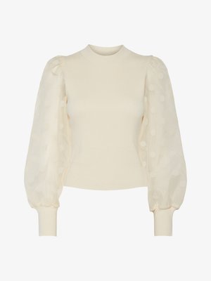 Crème geribbelde gebreide trui met doorschijnende pofmouwen met stippenpatroon. Aansluitende lijfje met zachte elastische manchetten.