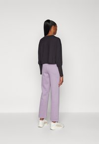 Puma STRAIGHT LEG SMALL LOGO PANTS  - Tracksuit bottoms - pale plum