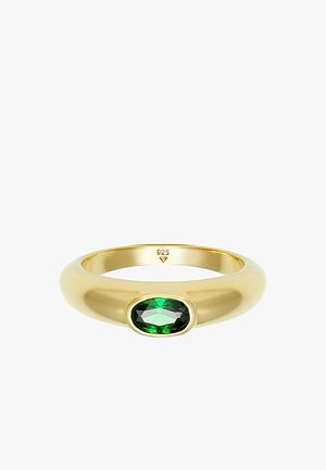 Auksu padengtas žiedas su ovaliu žaliu akmeniu viduryje. Lygi, poliruota paviršius, vidinėje juostos pusėje pažymėtas "925".