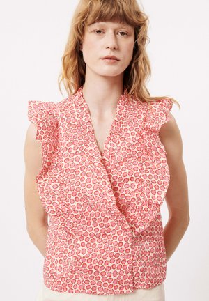 Top sans manches à imprimé floral en rose, avec des épaules volantées et un tissu léger et texturé. Petits motifs de fleurs remarquables tout au long.