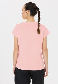 Korte mouwen roze T-shirt van zachte stof, met een ronde hals en een losse pasvorm, voorzien van details van de achternaad en zonder zichtbare logo's.