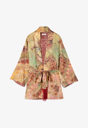 Giacca kimono leggera con motivi patchwork vintage multicolore, maniche larghe e cintura in tessuto abbinata con nappine rosse.