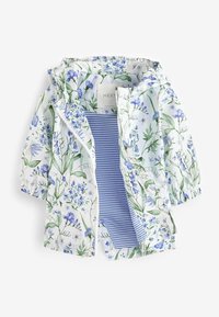 Veste à capuche blanche avec imprimé floral bleu et vert, partiellement ouverte pour révéler une doublure intérieure rayée bleu et blanc.