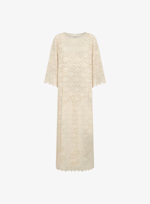 Abito in pizzo color crema, con vestibilità rilassata, scollo rotondo e maniche a tre quarti. L'orlo ondulato aggiunge texture e dettaglio di design.