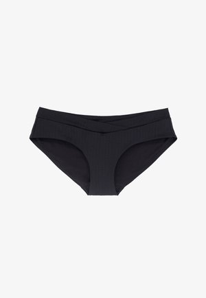 Sottoveste nera a bikini con un motivo testurizzato e ondulato. Presenta una vita ampia incrociata e un taglio standard per le aperture delle gambe.